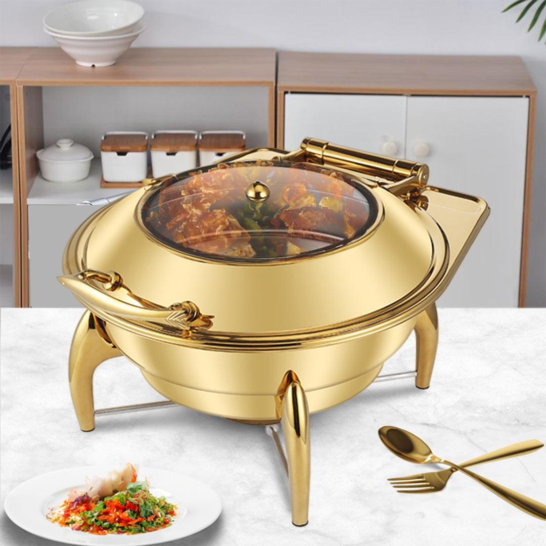 Gold-plated stainless chafing dish with open lid and serving pan on stand