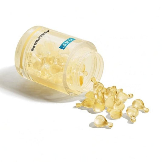 KEFUMEI capsule essence oil bottle with gold capsules spilling on the side