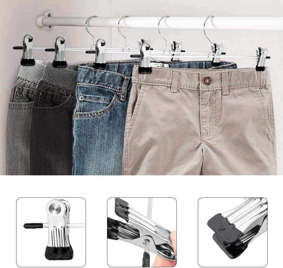 Chrome clip hangers holding jeans and khaki pants on a closet rod