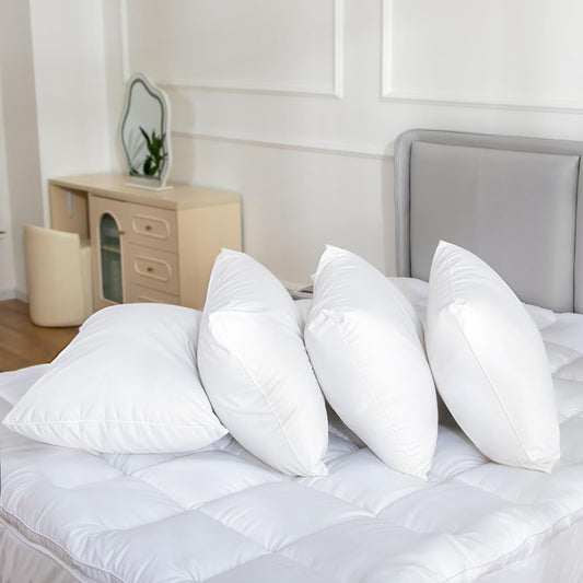White cotton bed pillows, multiple sizes with smooth stitched seams