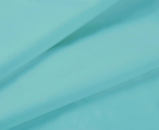 Aqua flat sheet fabric close-up with smooth weave and stitched edge
