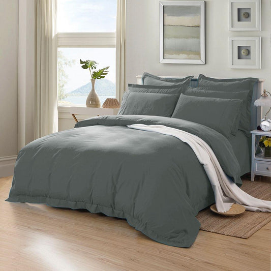 Charcoal duvet cover and shams set with folded top throw on a double bed