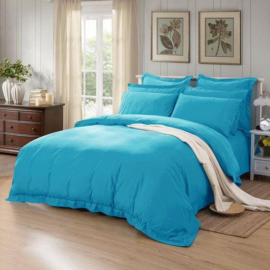 Light blue duvet quilt cover set with matching pillowcases, tailored style
