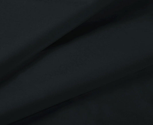 Black fabric close-up of fitted sheet with smooth wrinkle texture