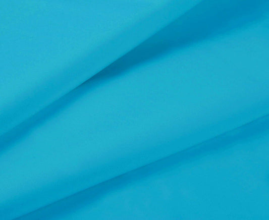 Light blue fitted sheet fabric close-up with smooth wrinkle-free finish
