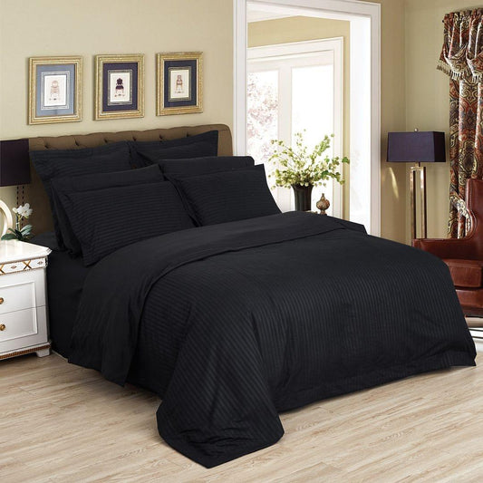 Black striped duvet quilt cover set with matching pillowcases, folded comforter-style
