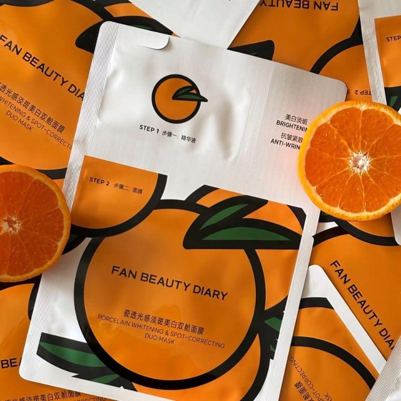Multiple FAN BEAUTY DIARY whitening mask pouches showing step 1 and step 2