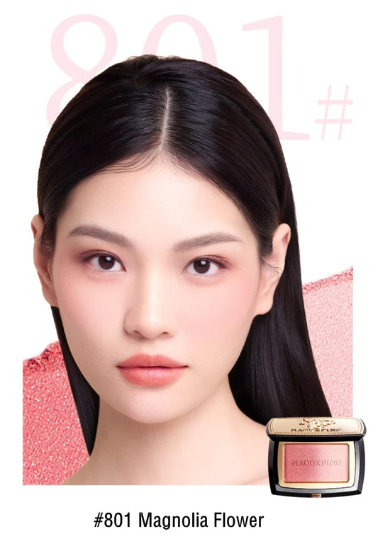 Woman wearing makeup with #801 magnolia flower blusher compact at side