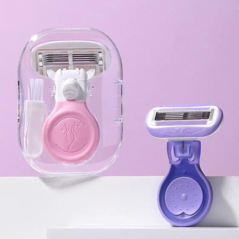Pink underarm razor with 5-blade head in clear travel case