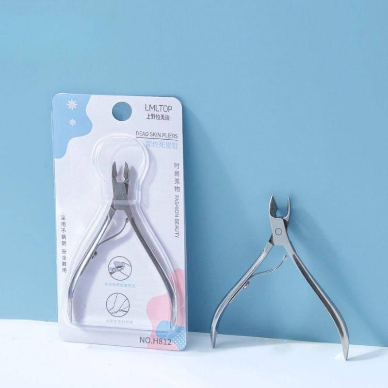 Stainless steel cuticle nipper in blister package, curved cutting jaws