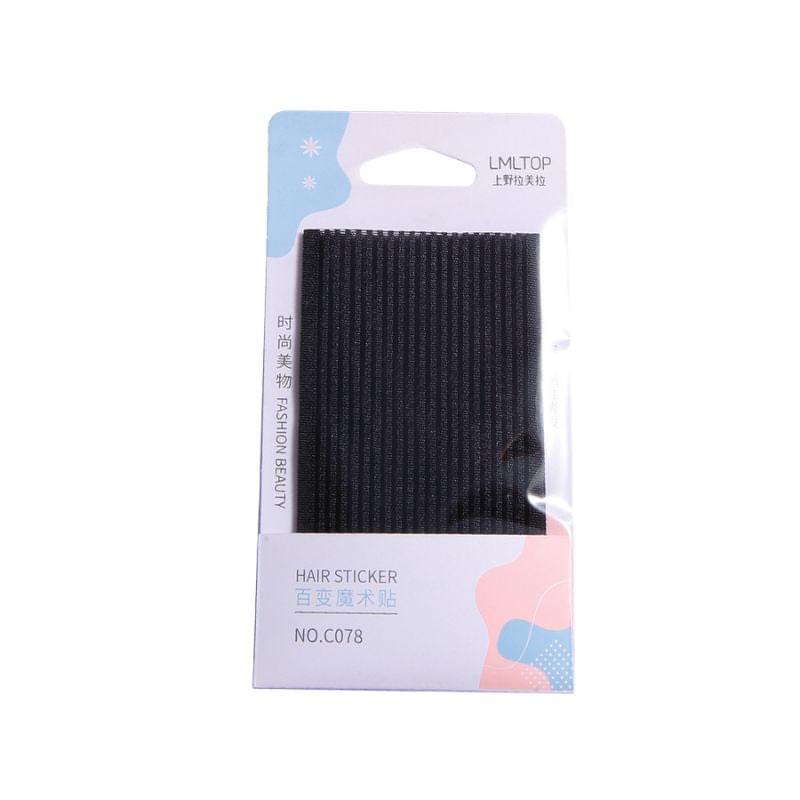 Black hair fringe sticker strip on card, self-adhesive backing