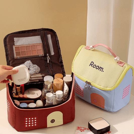 Cosmetic makeup bag with zipper top, open interior with brushes and bottles (red, blue).