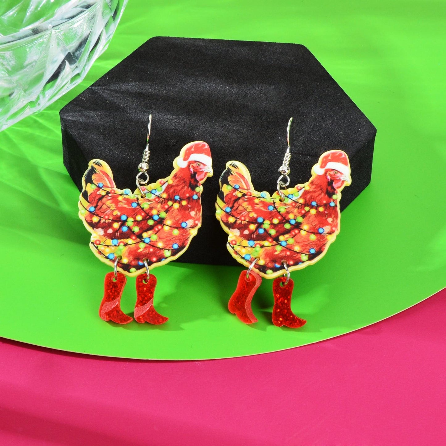 Pair of Santa acrylic dangle earrings with red hat and multicolor light speckles