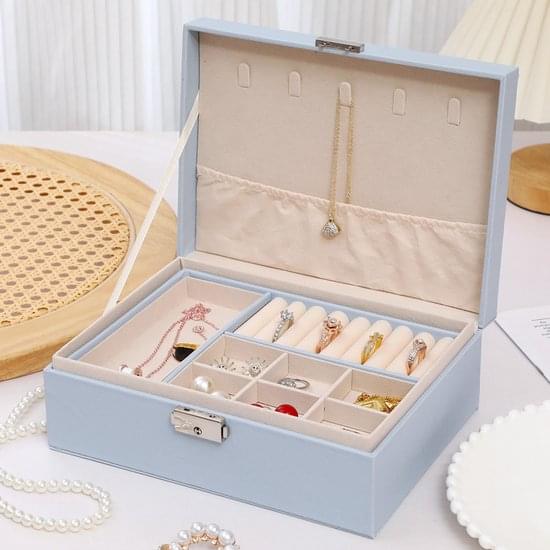 Light blue two-tier jewelry box with lock, open compartments for necklaces and rings