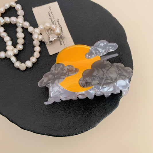 Acetate cartoon animal hair claw clip with orange center and clear ruffled edge