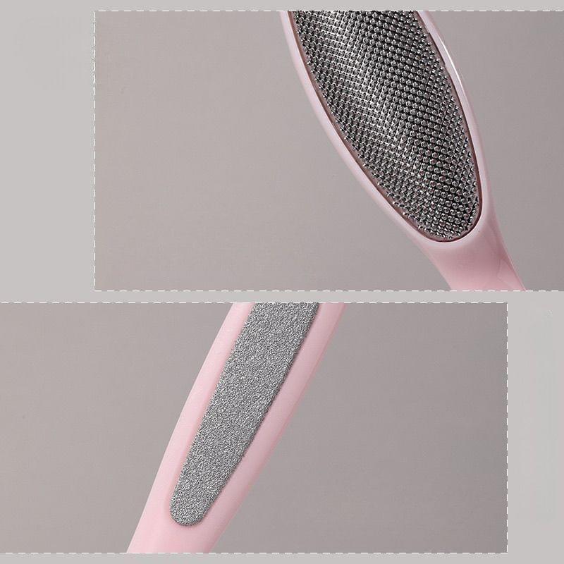 Pink foot file with textured stainless steel rasp pad, close-up of grippy surface