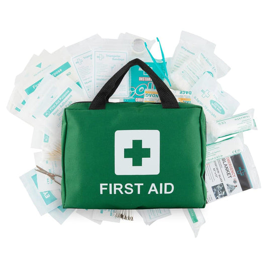 First aid kit bag with white cross icon on green pouch, with papers tucked behind