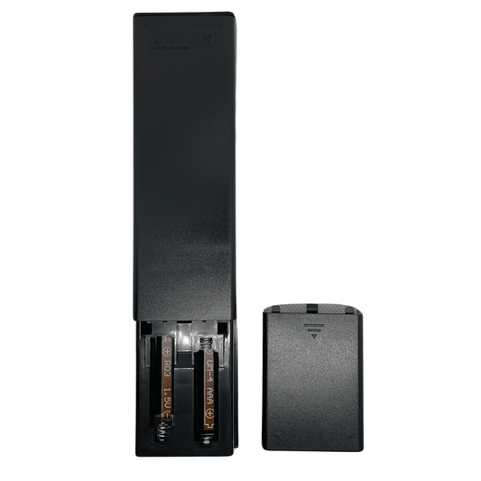 Remote control with open battery compartment and back cover, showing AA batteries, black