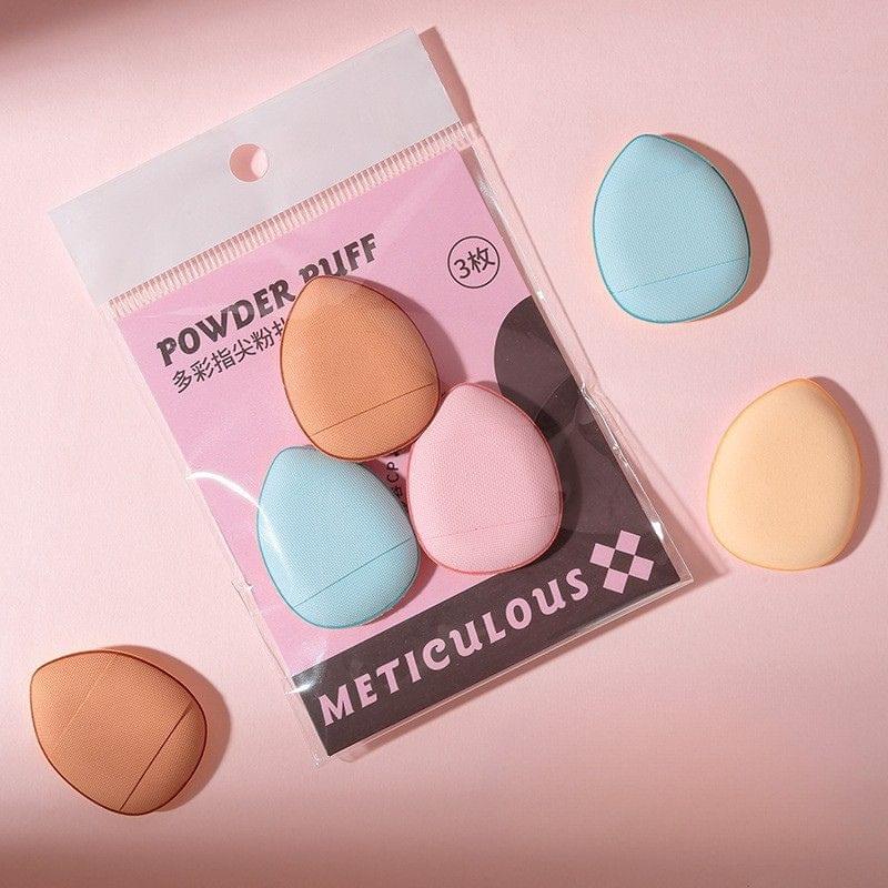 Mini makeup puff set with 3 finger puffs: blue, pink and tan, shown loose