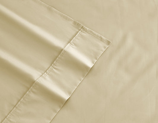 Light beige cotton-rich sheet fabric with stitched hem detail and corner seam