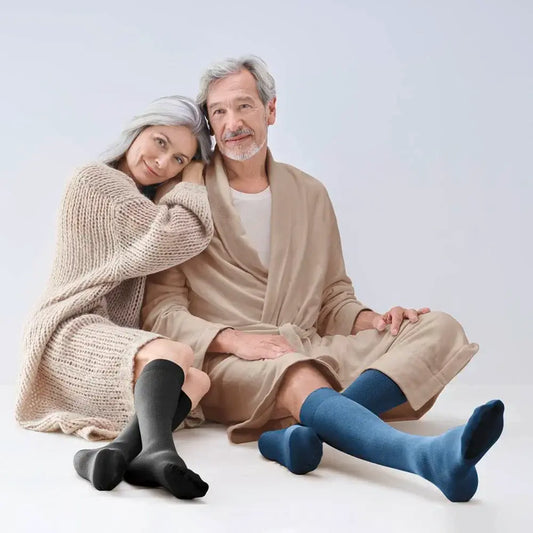 Knee-high compression stockings, black and blue pairs shown on legs and feet