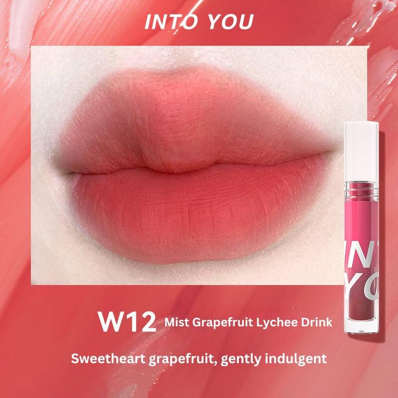 Lip swatch W12 with soft pink-red tint and glossy finish, shown with lip gloss tube