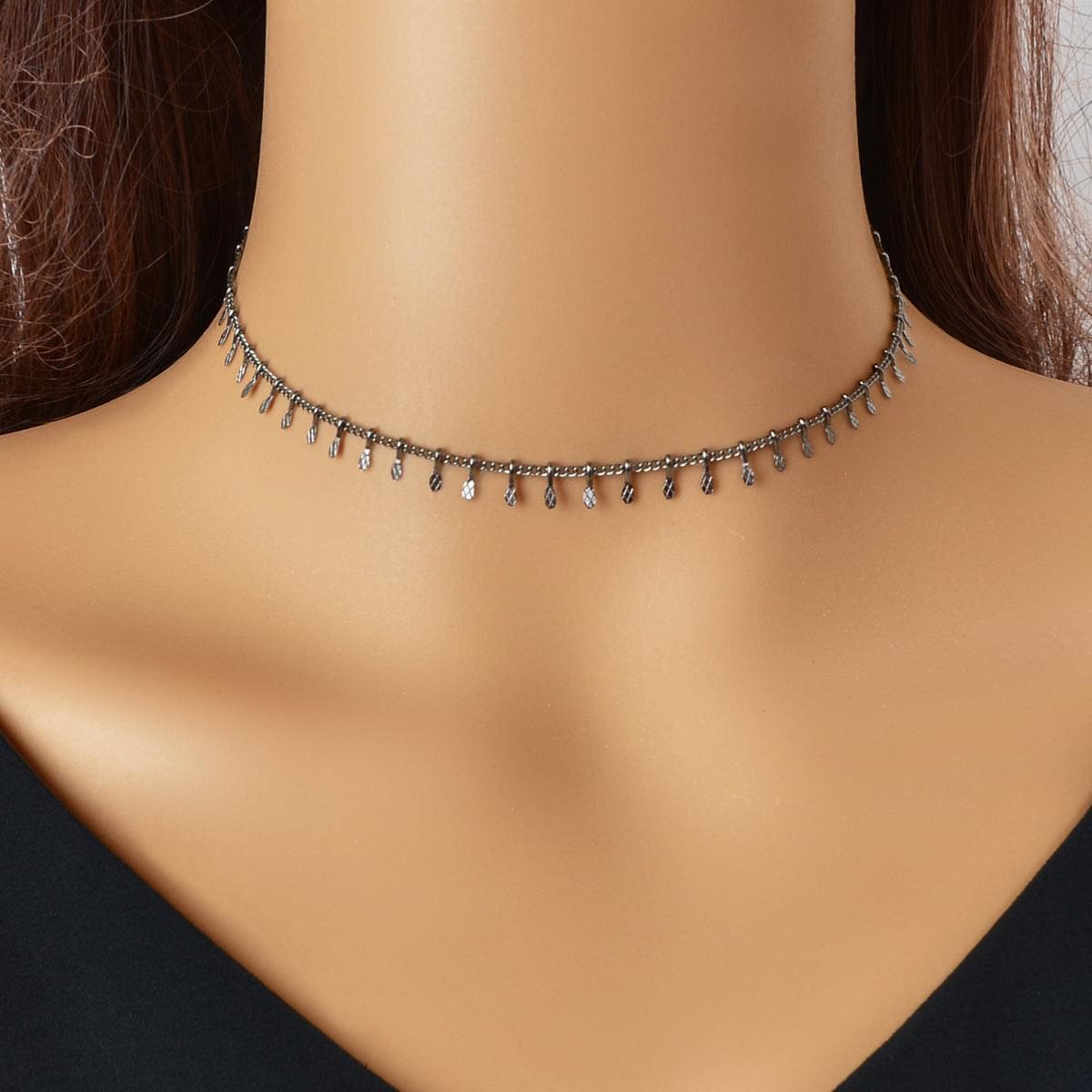 Dark-tone thin choker necklace with small dangling charms across the neckline.