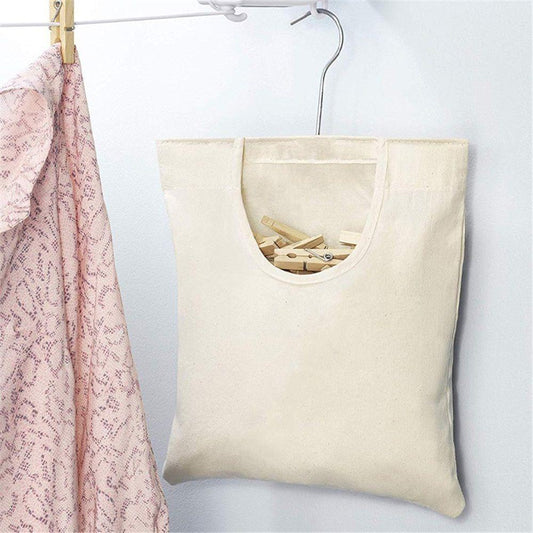 Beige canvas clothespin hanging bag with handle loop and clothespins inside