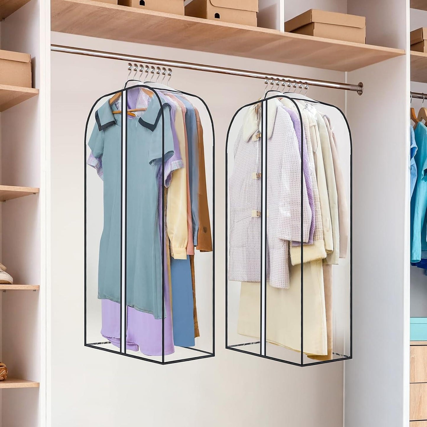 Two hanging clear garment storage bags with zipper openings and metal hanger bar hooks