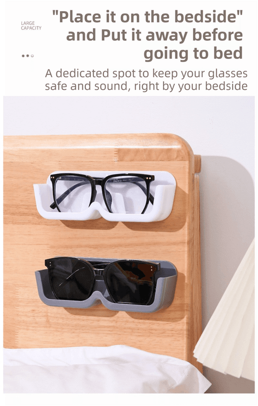 Wall-mounted glasses organizer shelf holding white-framed and black eyeglasses