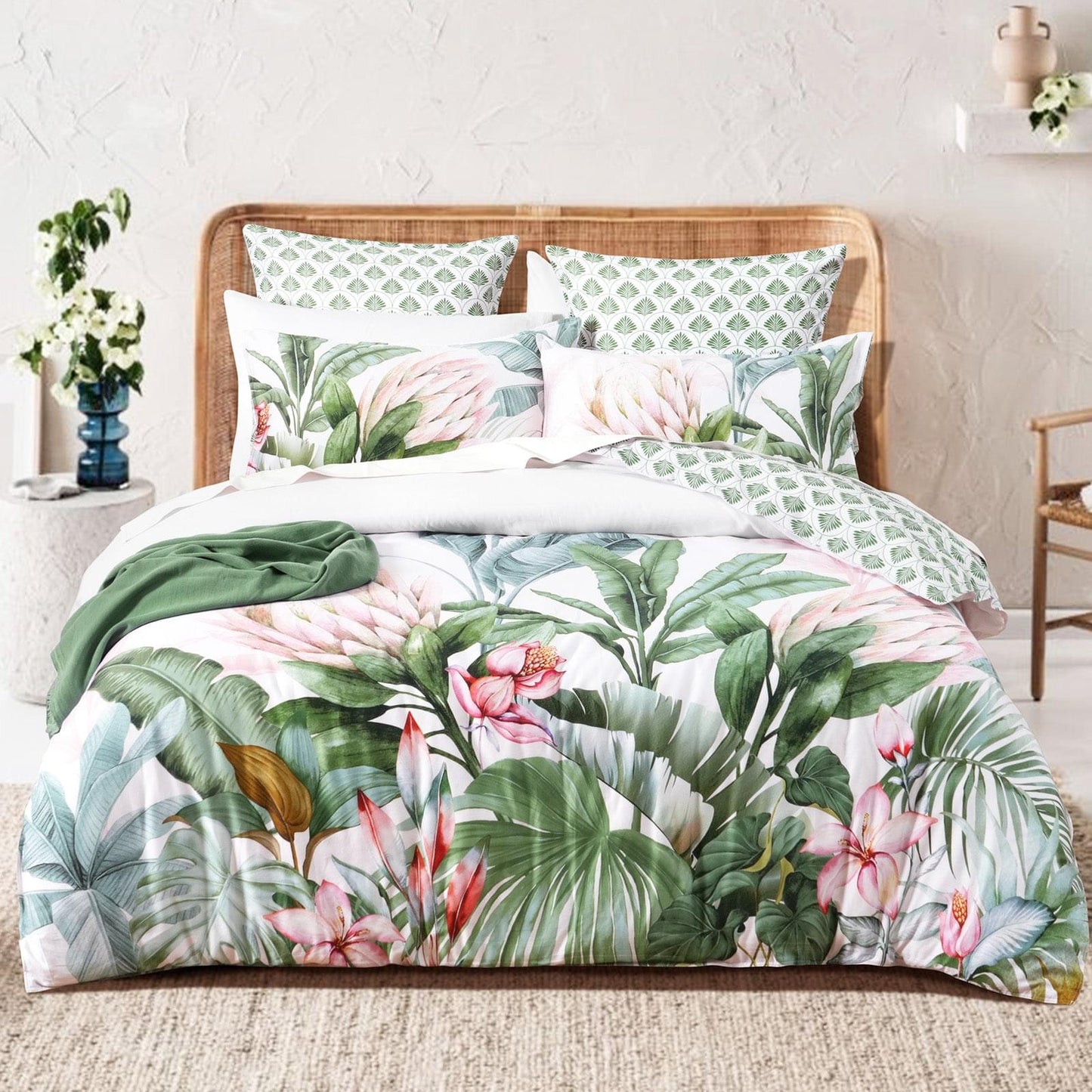 Kids quilt cover set on bed: pink and green tropical floral duvet with coordinating pillows