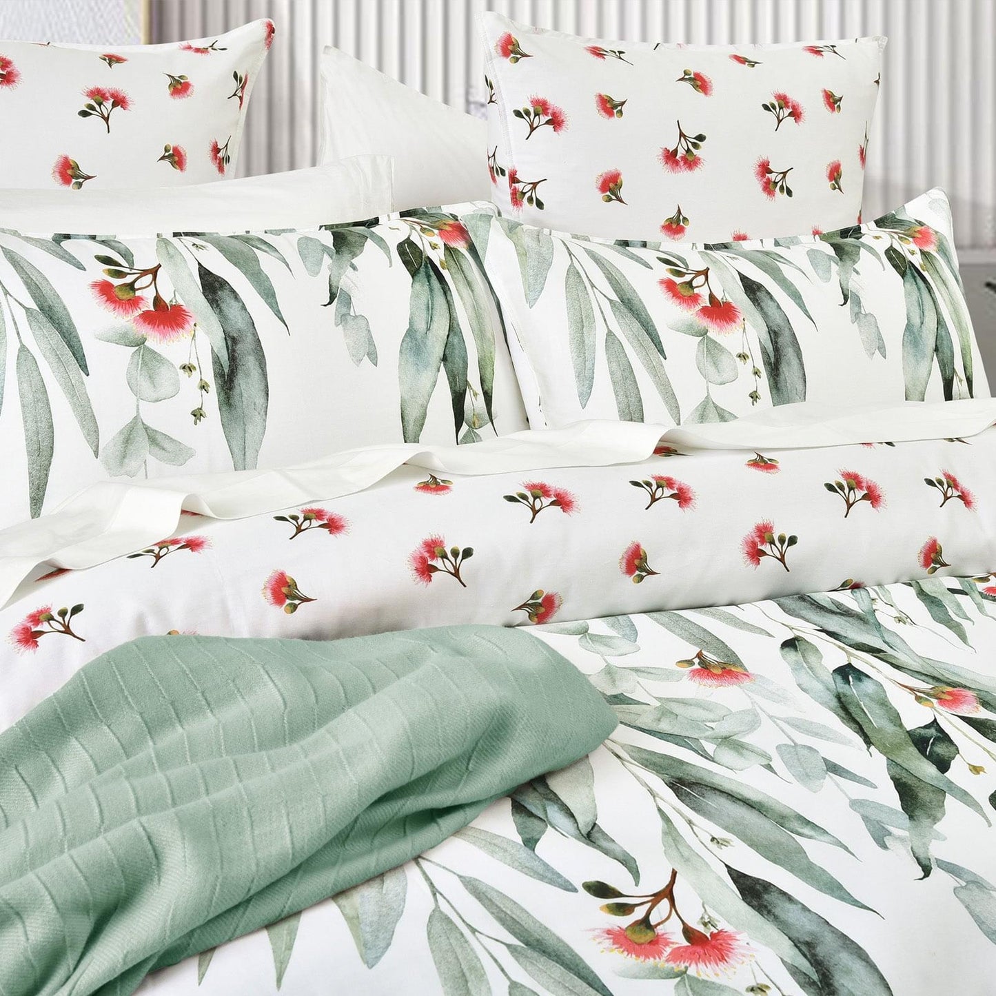 Kids quilt cover set close-up, mint reversible fabric with green eucalyptus leaf print