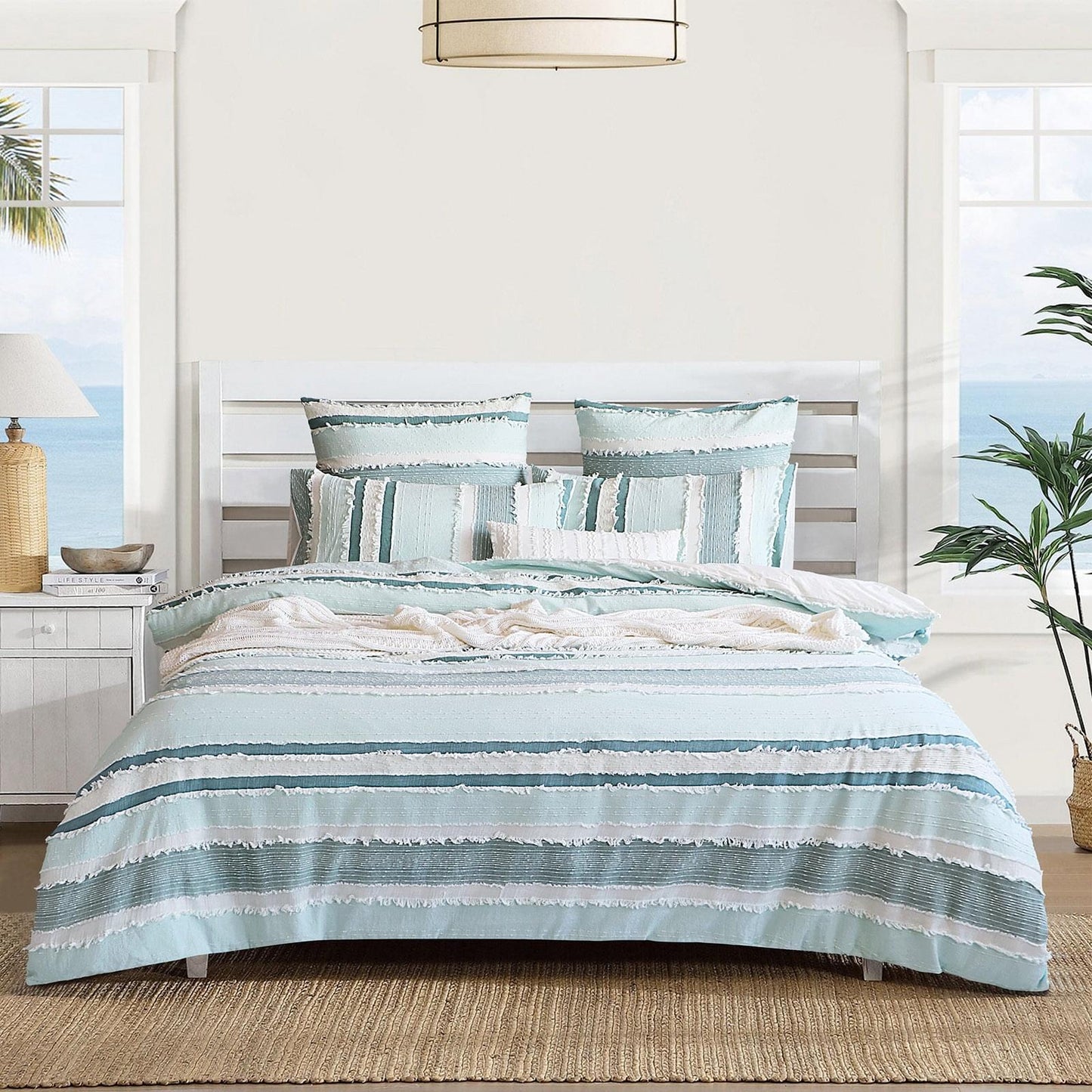 Light blue striped quilt cover set with ruffled trim and coordinating pillowcases