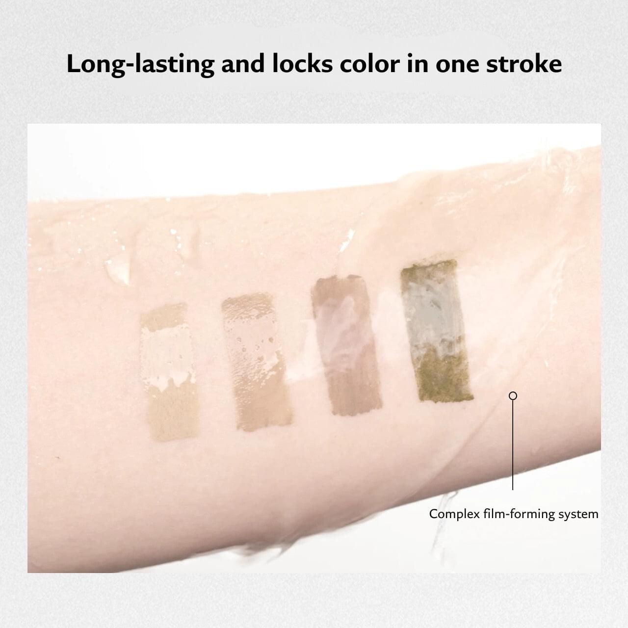 Brow mascara swatches on forearm showing long-lasting color in one stroke