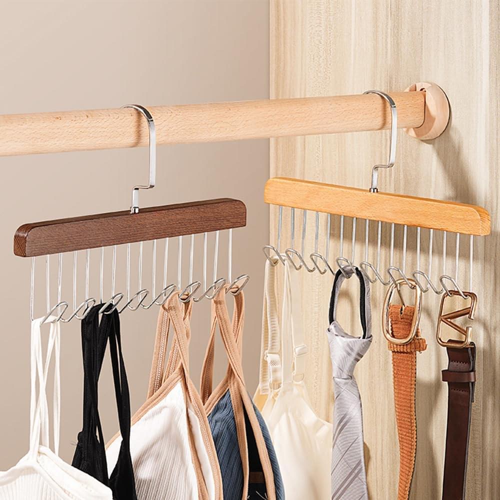Wood multi-hook hanger set on rod, dark brown and light tan bars with belts on hooks