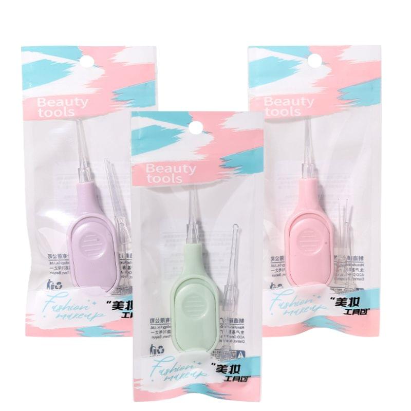 Light-up ear pick tool sets in pastel purple, pink, and green packages