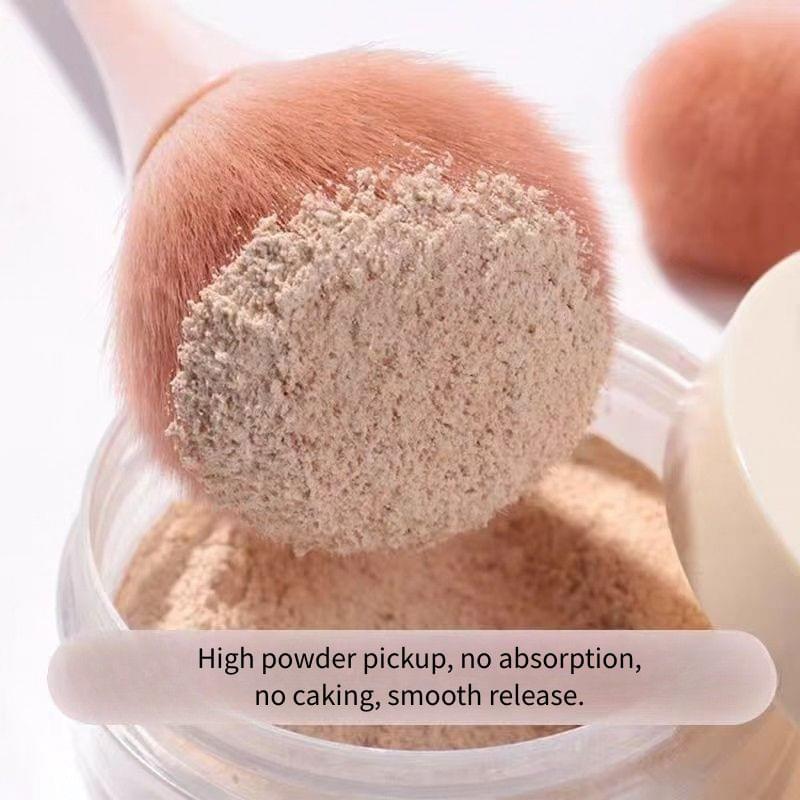 Loose powder brush bristles dusted with light beige powder for smooth pickup