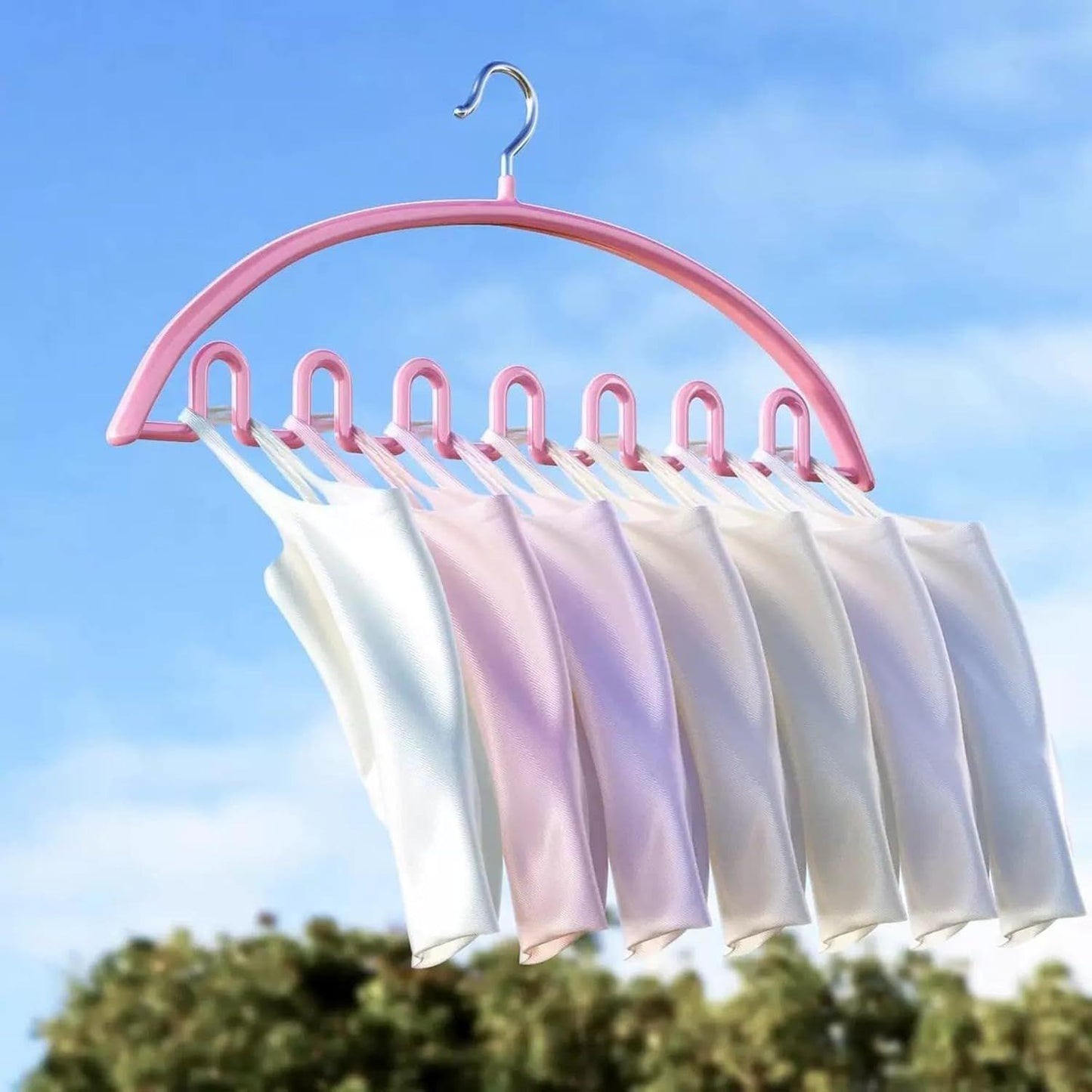 Wave-style hanger with metal hook, pastel pink frame holding five garments