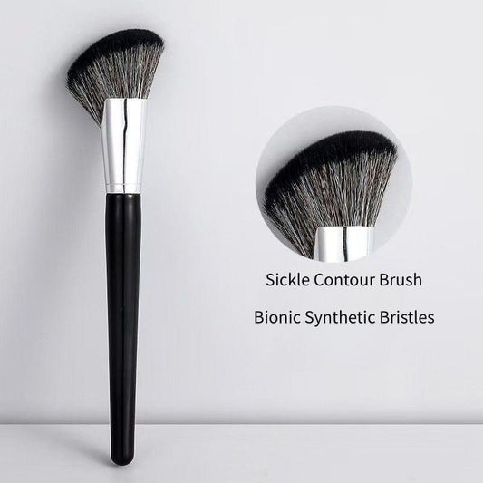 Large angled contour brush with black grip, silver ferrule, rounded head of synthetic bristles