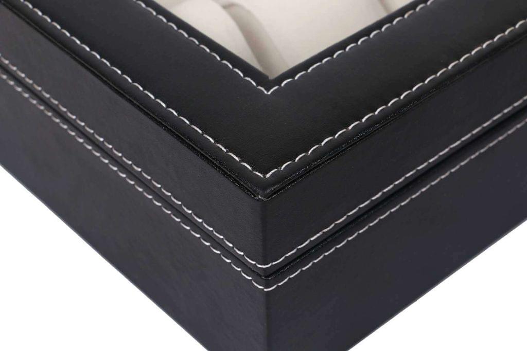 Black storage box corner with double-stitched trim and padded edges.