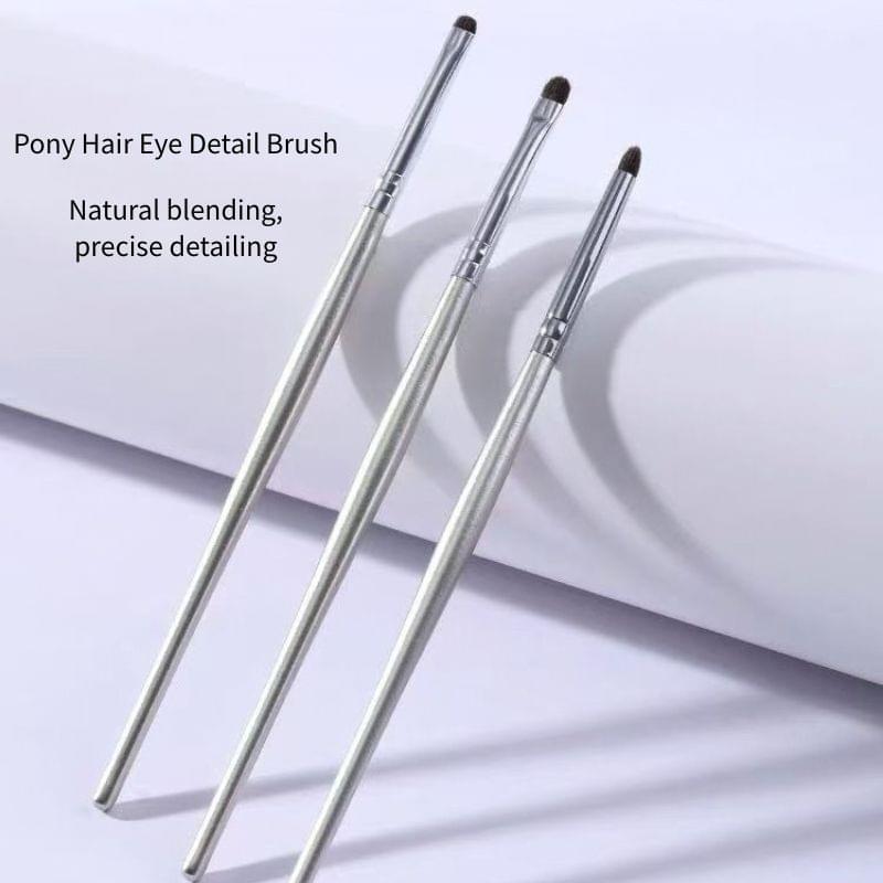 3-piece eye detail brush set with slim silver handles and pointed dark bristles