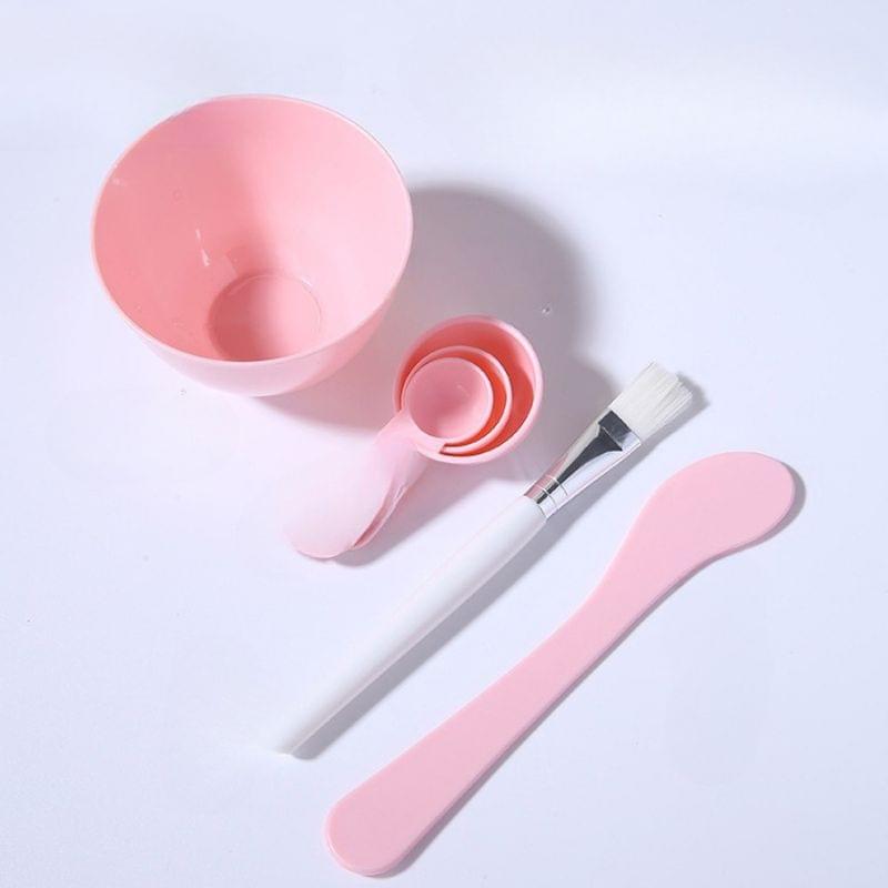 Pink mixing bowl with funnel scoop, brush, and two silicone applicator spatulas