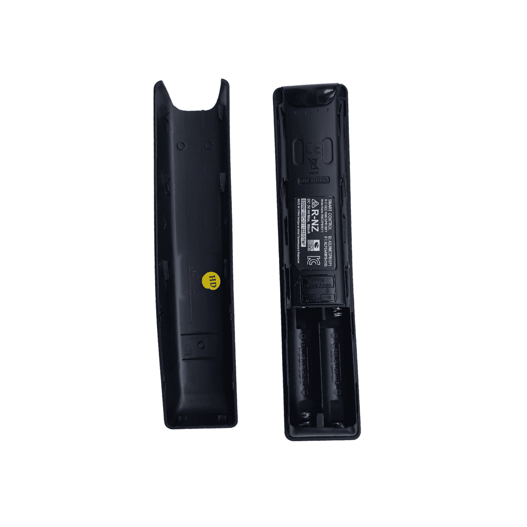 Black remote back cover shown with battery compartment and label