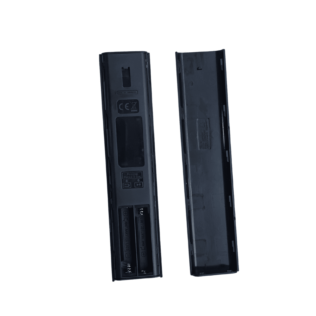 Black TV remote control backside with battery compartment and service label