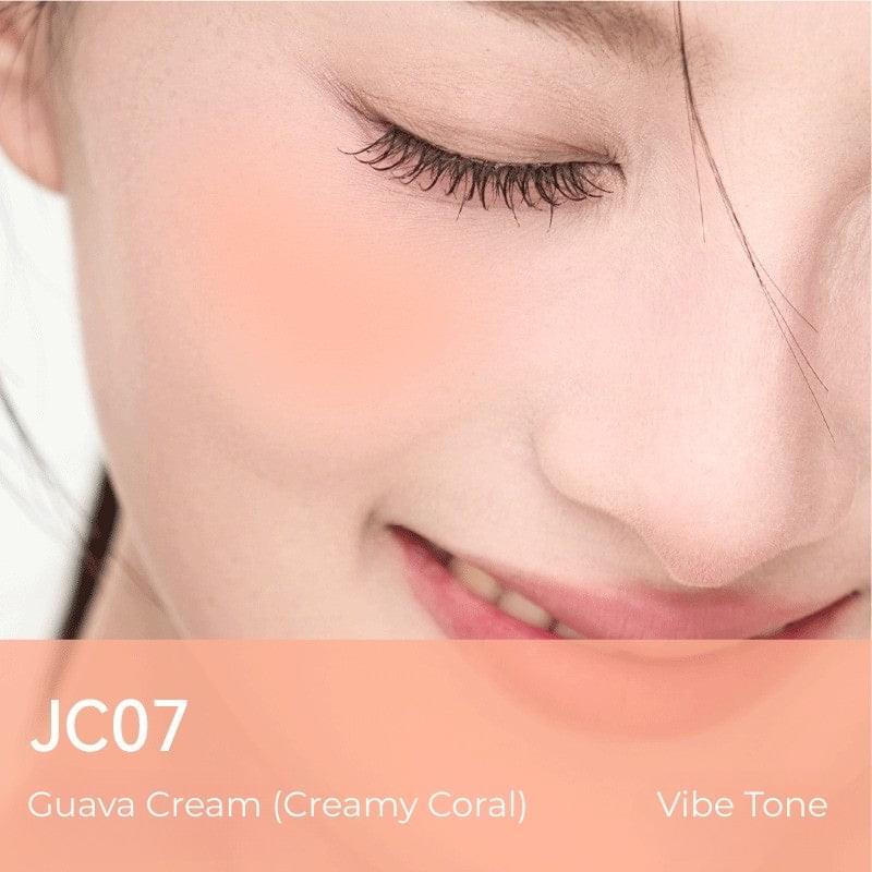 Liquid blush shade JC07 on cheek, peach-orange tint