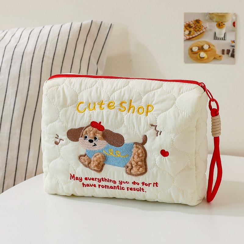White quilted cosmetic bag with red zipper; Cute Shop puppy and dog applique