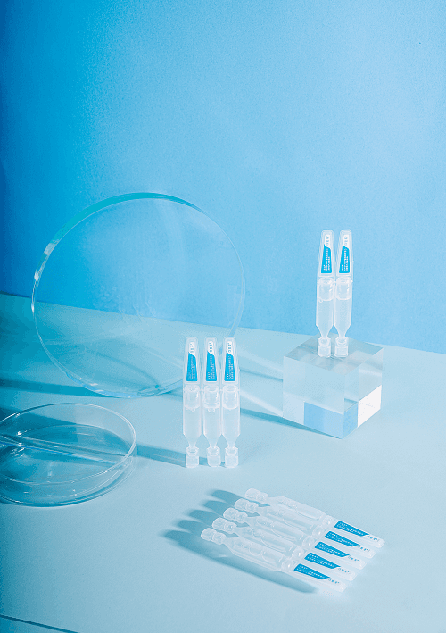 Collagen restoration essence ampoules arranged on a display platform with clear vials