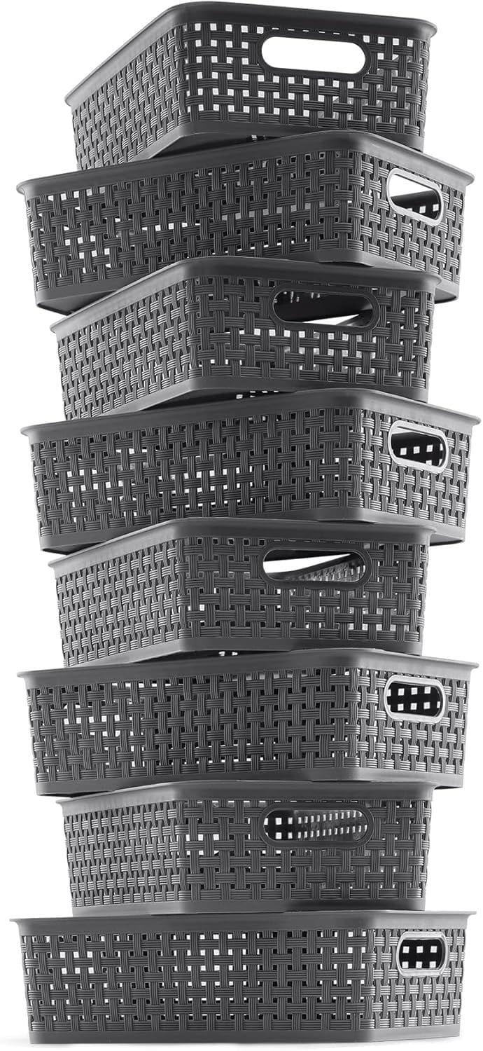 Dark gray woven plastic storage baskets stacked, each with cutout handles