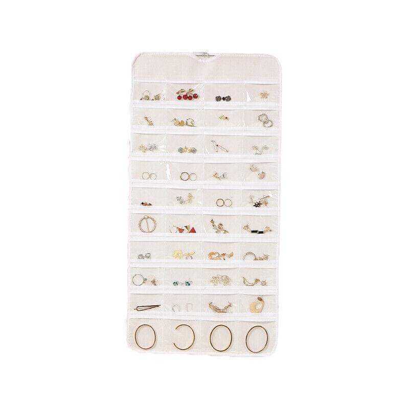 White hanging jewelry organizer pouch with many clear pockets for small jewelry
