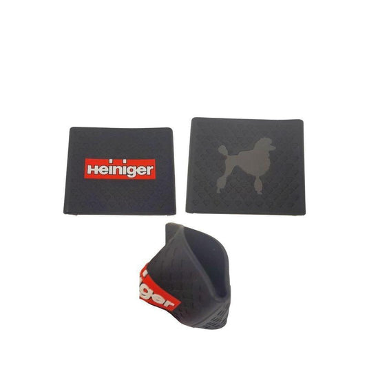 Anti-slip clipper grip pads, black with red Heiniger logo; includes curved cover
